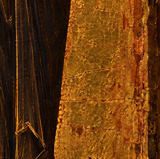 Close detail of gold leaf squares with red bole showing through, beside the habit's gold highlight lines
